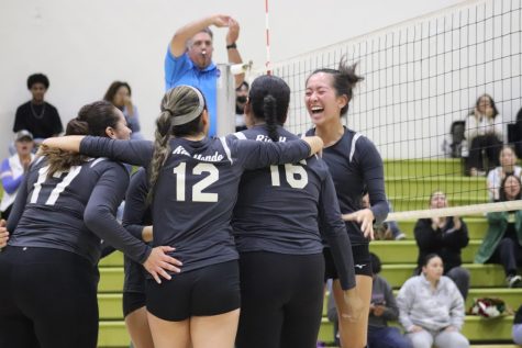 RHC Womens Volleyball excited after scoring a point that ended the game. This is their sixth game that they won.