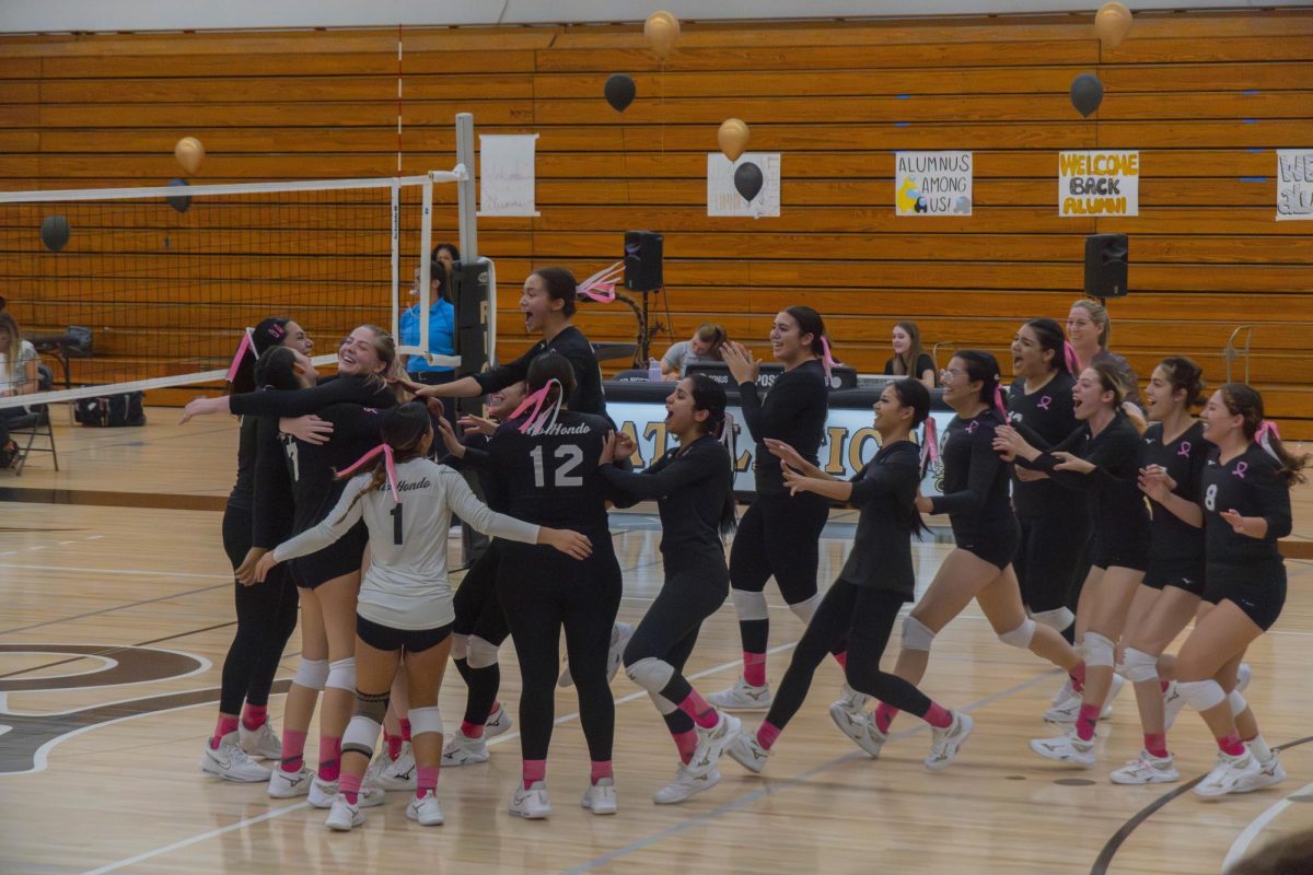 Lady+Roadrunners+storming+the+court+after+3-1+victory+against+cerritos+college.